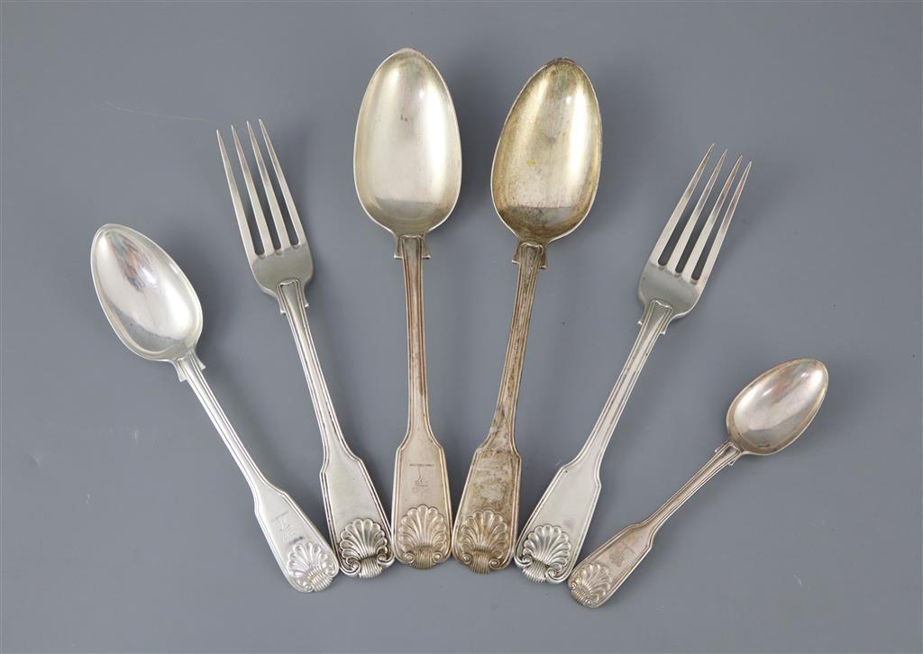 A part canteen of William IV silver double struck fiddle, thread and shell pattern flatware by William Eaton,